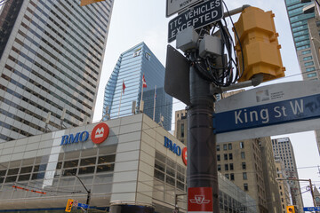 Fototapeta premium exterior building facade and corporate logo sign of BMO Financial Group outside headquarters at First Canadian Place, northwest corner of 100 King St W and Bay St, Toronto