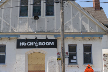 Fototapeta premium exterior building facade and sign of Hugh's Room Live, a music venue, and former place of worship, located at 296 Broadview Av, Toronto