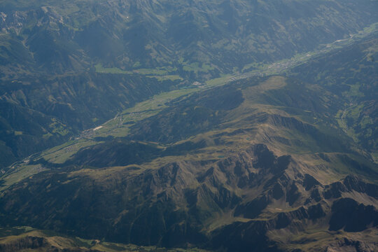 Switzerland, July 20, 2026: Aerial view of rugged Swiss Alps mountain landscape with valleys and alpine terrain, travel and tourism