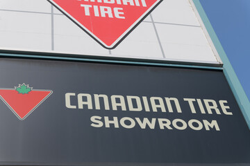Fototapeta premium close-up of road-side pylon sign of Canadian Tire, a department store, located at 825 Eglinton Av E (East York), Toronto