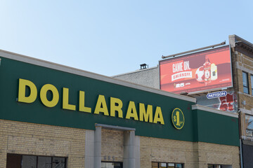Fototapeta premium exterior building facade and sign of Dollarama, a dollar store chain, located at 685 Danforth Av, Toronto