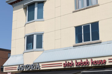 Fototapeta premium commercial block with sign of Astoria Shish Kebob House, a Greek restaurant, located at 390 Danforth Av, Toronto