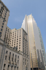 Fototapeta premium Royal Bank Plaza and the Châteauesque Fairmont Royal York at 100 Front St W, Toronto, designed by Ross and Macdonald (with Sproatt and Rolph) for the Canadian Pacific Railway as a grand hotel