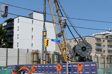 Fototapeta premium heavy machinery at a construction site for the new Ontario Line (Cosburn Station at Pape Avenue and Cosburn Avenue), Toronto