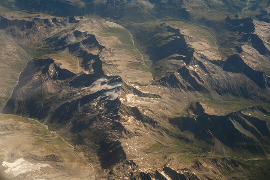 Aerial view of rugged Swiss Alps and glacial valleys