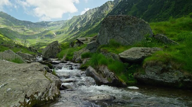 Rocky Alpine Stream Beneath Rugged Carpathian Peaks