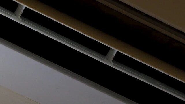 A residential air conditioning unit mounted on a wall, suitable for interior decoration or architectural photography