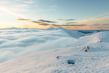 Winter mountain sunset landscape above clouds in Zakopane, Kasprowy wierh, Poland. © Alena Malinouskaya