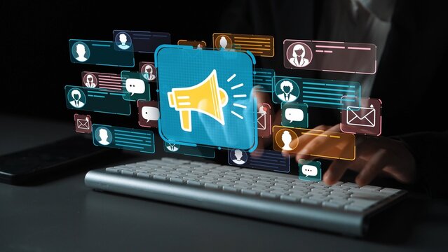 Digital marketing communication concept with megaphone, social media notifications, and keyboard during online engagement and outreach efforts. Entropy.