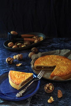 Swiss confectionery specialty from Grisons Engadine  - the Buendner Torte in dark and moody background