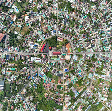 Aerial view of Tan Ha Village with a distinctive Bagua-shaped road layout in Bao Loc, Lam Dong, Vietnam.