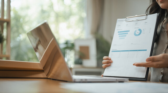 online financial report with meeting presentation; an online business with a report and screen. online guides buyer choices, financial frames the scene, and report adds useful meaning.