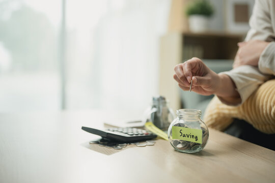 saving money goals with planning finance; a savings jar and coins representing a personal goal. saving guides buyer choices, money frames the scene, and goals adds useful meaning. For useful context.