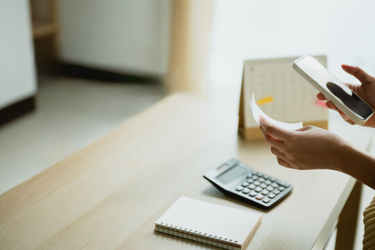 smartphone expense tracking with calendar budget; a phone and used to organize household figures. smartphone guides buyer choices, expense frames the scene, and tracking adds useful meaning.