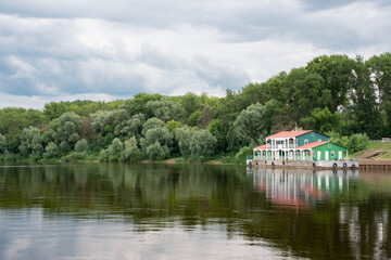 Fototapeta premium Floating Landing Stage Debarkader on River with Forest Reflection