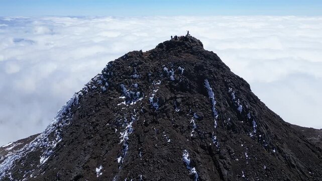 Drone View of People Standing on Pico Mountain, the Highest Peak in Portugal, on Pico Island in the Azores