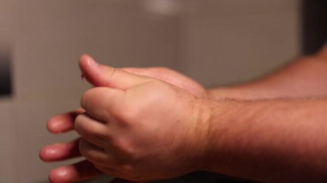 Defocused 4K video close up. 60 fps. Chef makes, forms round meatball, burger patties, cutlet of ground beef, pork, lamb, minced meat with male hands on kitchen table. Health food preparation. Cafe