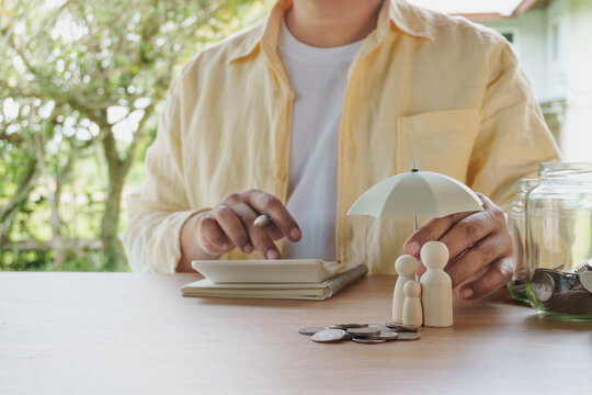 Family financial planning with life insurance and financial protection for parents and child, savings, coins, umbrella, financial security, household budget, risk management and future planning