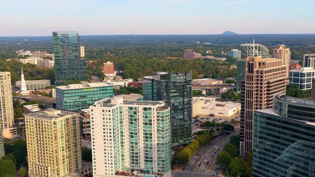 Aerial view of Buckhead downtown city landscape in Atlanta with skyscraper buildings. Urban growth, transportation infrastructure and modern American metropolis.