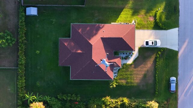Autonomous drone flight over suburban community during golden hour, highlighting residential architecture, green yards and calm neighborhood atmosphere.
