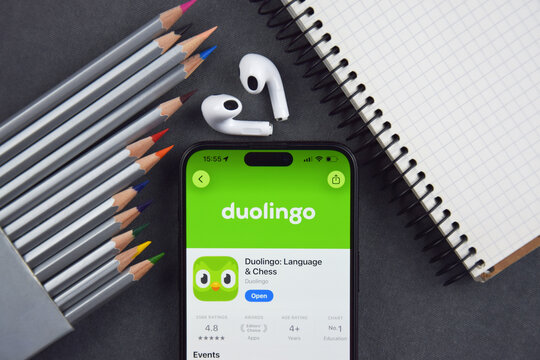 Kharkiv, Ukraine, 7 August 2026: Duolingo app on the smartphone iPhone 15 screen. Grey background