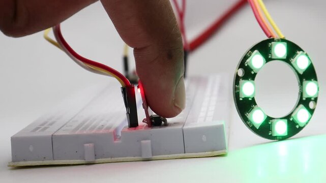 Placing a finger on touch sensor fills an 8 bit RGB ring LED with color one light at a time followed by a blink shows concept of authentication