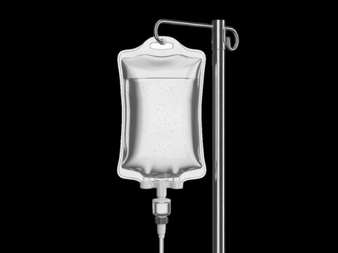 A clear medical IV fluid bag hanging on a chrome metal hospital stand setup