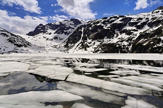 Ice floes float in the half-frozen Upper Murgsee, Murgtal, Canton of St. Gallen, Switzerland