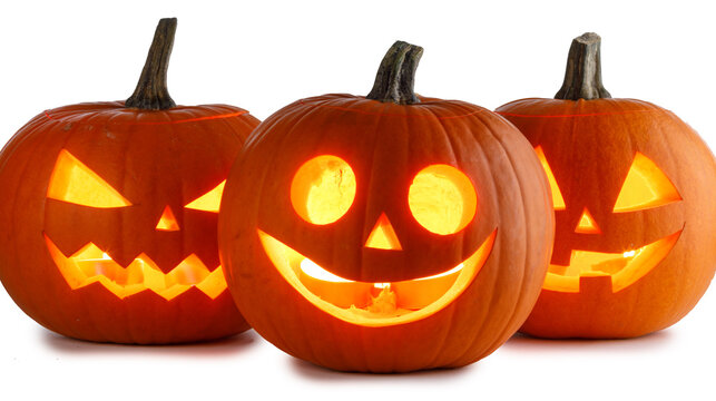 Group of spooky Halloween pumpkins with glowing faces