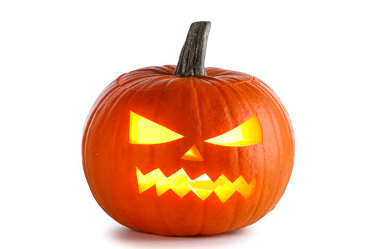 Group of spooky Halloween pumpkins with glowing faces