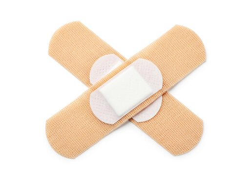 Two adhesive bandages crossed forming an x shape