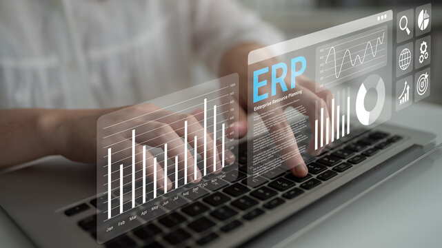 A business professional engaged in data analysis on a laptop, utilizing ERP software displaying visual graphs and charts for informed decision making and strategic planning. Ledger