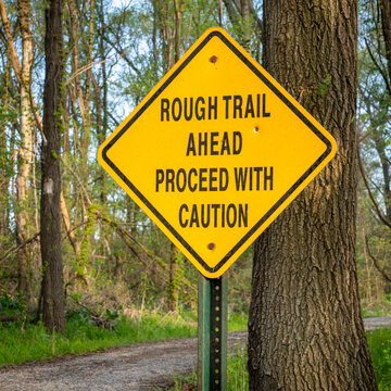 rough trail ahead, proceed with caution - warning sign on Steamboat Trace Trail converted from old railroad near Peru, Nebraska