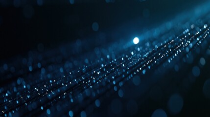 Fototapeta premium Abstract blue digital data stream with glowing binary code flowing diagonally through a dark futuristic background