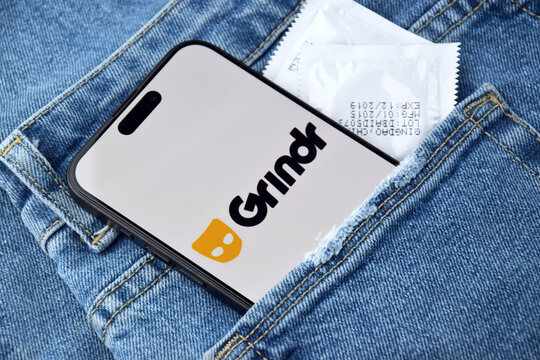 Grindr dating app on smartphone screen.
