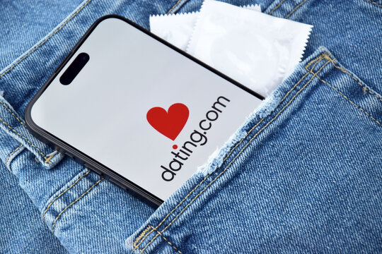 Datingcom dating app on smartphone screen.