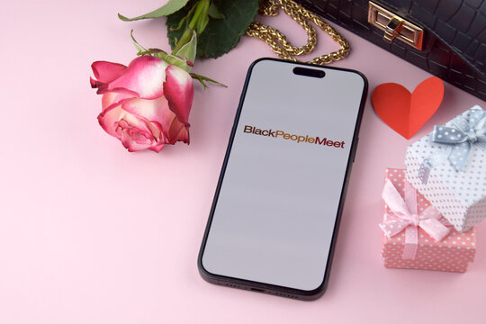 Blackpeoplemeet dating app on smartphone screen.