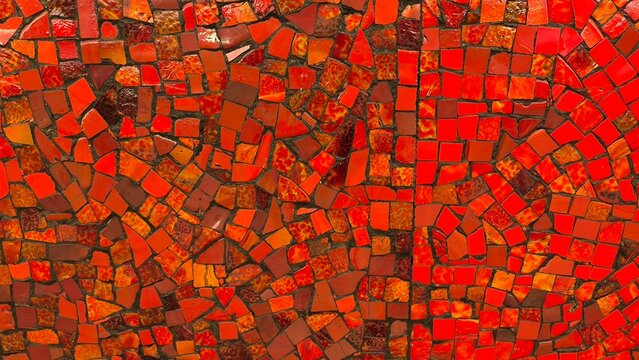 a wall made of red mosaic panels,    