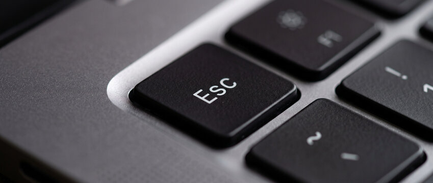 Esc Key on Modern Laptop Keyboard Close Up Macro Technology Background
