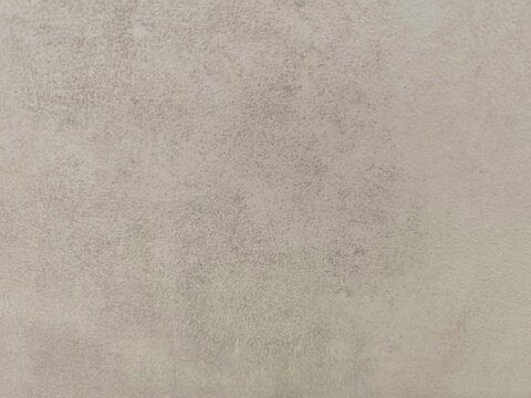Close up view of minimal light grey concrete texture with smooth matte finish

