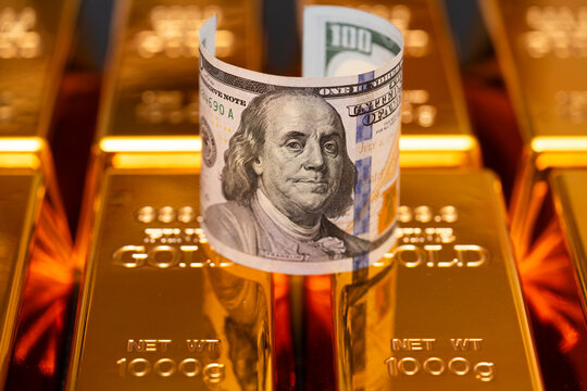 Banknotes in cash for gold trade. Financial trade. Dollar bills in USA for currency. Money in cash or Gold bar.