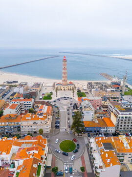 Aveiro barra lighthouse overlooking atlantic ocean and coastal town
