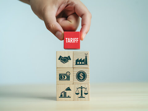 Hand stacking red and wooden cube blocks