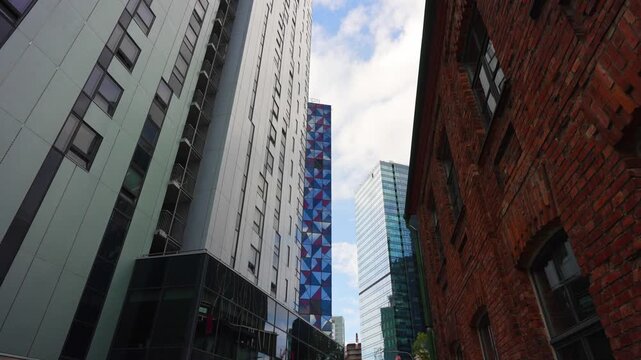 Modern skyscrapers rising above high-rise financial district buildings.