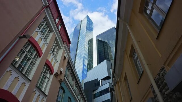 Modern skyscrapers rising above high-rise financial district buildings.