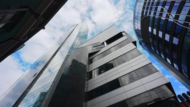 Modern skyscrapers rising above high-rise financial district buildings.