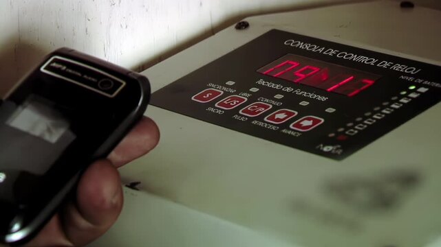 Technician Programming Digital Clock Control Console Inside Clock Tower - 4K