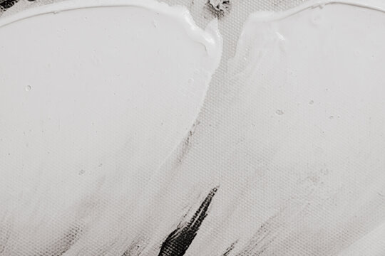 Full frame close up view of white acrylic paint strokes on art canvas texture background surface concept of modern abstract fine art painting creative studio photo