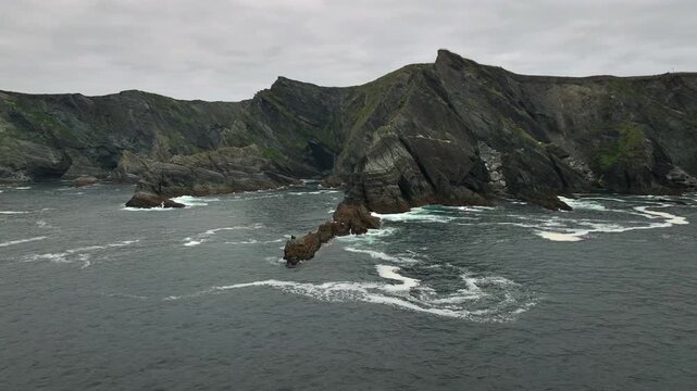 Kerry Cliffs at Cloudy weather Aerial Shot. Dramatic Rocks on the West Ocean Coast in Kerry County, Portmagee, Ireland