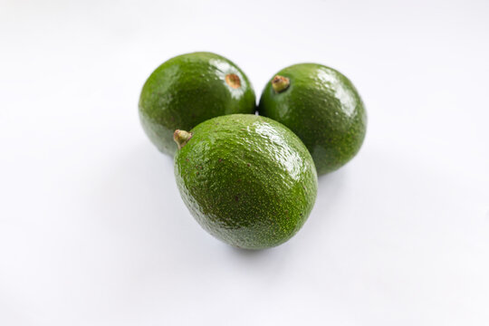 Fresh avocado on white background. Vegetarian food concept.